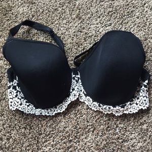 size 36DDD black with ivory flower detail bra.